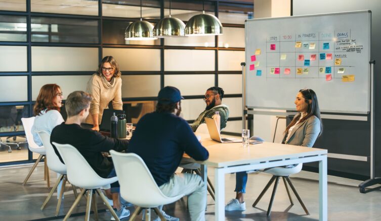 Business,People,In,A,Boardroom,Engage,In,A,Discussion,,Exchanging