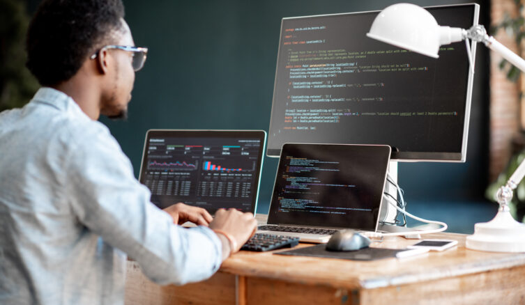Young,African,Male,Programmer,Writing,Program,Code,Sitting,At,The